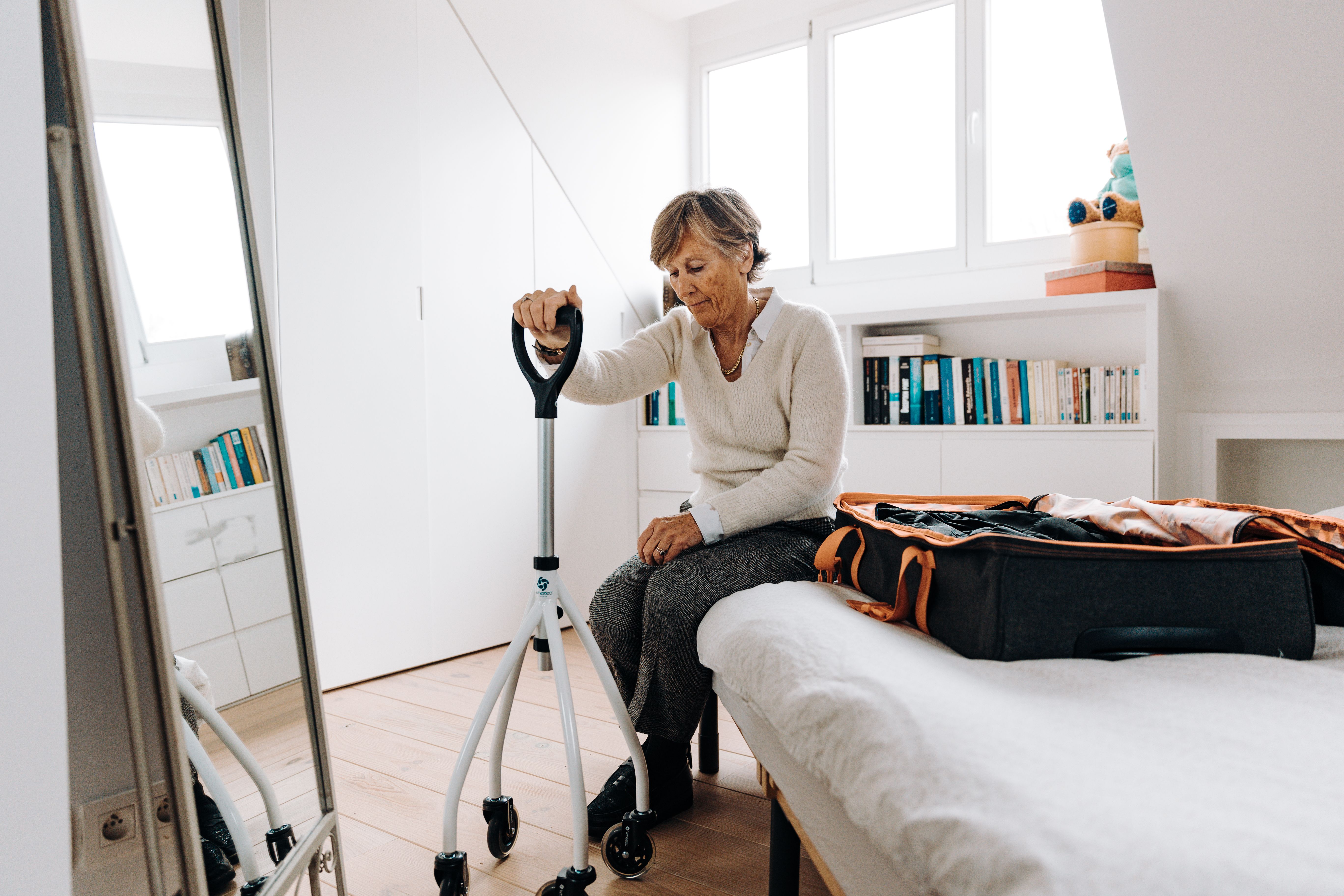 Elderly patient receiving safe wheelchair transportation support
